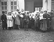 French nuns in Valenciennes and civilians greet the first Canadians to enter that part of the town November 1918.