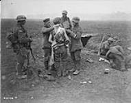 A wounded German having his wounds dressed. August 1918 Aug. 1918.
