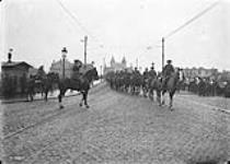 General Sir Arthur Currie takes the salute as the British Cavalry cross the Rhine at Bonn. Dec., 1918