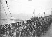 Corps Commander, General Sir Arthur Currie, taking the salute of the 2nd Canadian Division on the Bridge at Bonn, December 13th, 1918, (24th Battalion passing Saluting Base) December 13, 1918.