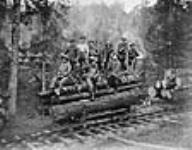 Personnel of the Canadian Forestry Corps loading timber 1919