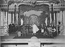 Gertie Allbut makes 'her' entrance during the first act. 'See Toos', 2nd Canadian Division Concert Party in 'We Should Worry', Bonn. January, 1919 Jan., 1919