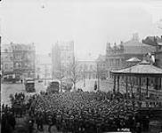 Corps Commander explains demobilization to Canadian troops in the square at Andenne, February 1919 Feb. 1919
