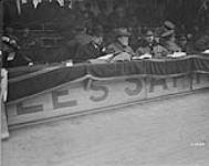(Spectators) Sir Robert Borden, Sir George Foster & Maj. - Gen. Morrison watching sports at Palais des Sports. "Corps Sports", Brussels, 22nd March 1919 1914-1919
