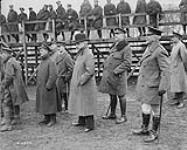 (Spectators) Premier Borden, Gen. Currie and Gen. Macdonnell watching Baseball final. - "Corps Sports, Brussels, 22nd March 1919 1914-1919