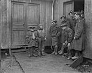 Two French boys at Embarkation Camp, Havre - 'Inspection of 4th Canadian Division by King Albert of Belgium.' March 1919 Mar. 1919
