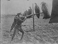 8th Battalion. Winnipeg Rifles, on Salisbury Plain. Bayonet Practice with bags of straw 1914-1919