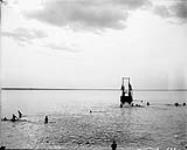 View of swimmers from pier in Britannia n.d.