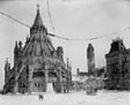 View of the Library of Parliament and the Centre Block on the day after the Centre Block fire 3 Feb. 1916