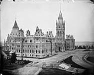 Parliament Buildings: [Library of Parliament and Centre Block] seen from the West Block [1859 - 1900].