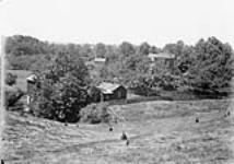 View from Hog's Back, showing W.D. Scott's residence July, 1910.