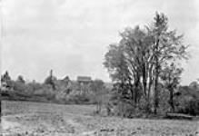 W.D. Scott's residence from lower field July, 1910.