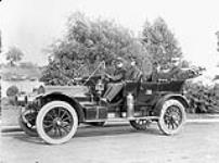 Chief Graham & assistants in auto "Fire Brigade" [ca. 1911].