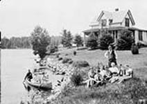 Headquarters Algonquin Park Ont. with Mr. & Mrs. Bartlett & Family 1913.