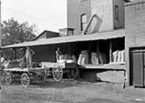 At a flour mill October, 1913.