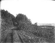 [Country Road showing Village in distance.] 1868-1923