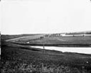Looking east, irrigation canal and Bow River, 3 C.P.R. (Canadian Pacific Railway) 1868-1923