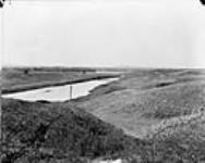 Looking west, showing canal, Bow River and Jap Town in distance, 4 C.P.R. (Canadian Pacific Railway) 1868-1923
