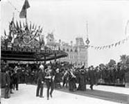 [T.R.H. The Duke and Duchess of Cornwall and York in procession from Royal Pavilion to Centre Gate Parliament Hill] September 20, 1901.