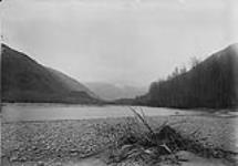 (Canada Alaska Boundary) Looking up Dyea Pass from point 1 1/2 mile above tide water (Raining) 1897
