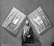 [Orangeman (Hugh Hind?) and Orange flags.] [ca. July 16, 1877].