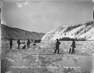 Harman & Welbon harvesting ice for Dawson Market, Klondyke [Klondike] River, 1902
