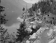 Slocan Lake, B.C., Molly Hughes wharf and lower tunnel entrance, 1 mile north of New Denver Looking North Sept. 1928