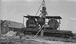 Mixing plant on car, Edmonton, Alta Apr. 10, 1930