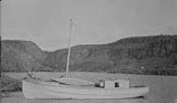 W.A. Boland's "Star" gas-boat freighting on Great Bear Lake at Eldorado dock, Great Bear Lake N.W.T. Aug. 1931