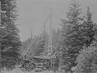 Keystone drill testing bank above Lightning Creek near Barkerville, B.C 1938