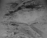 Blasting loose rocks at Bullion: - Near end of 40 secs - most of fuses are lighted - "splitters out", Quesnel River, B.C 1938