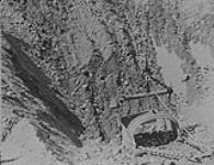 Gravel Machine operations: - Looking down into mouth of excavator basket, Fraser River, 5 miles North of Quesnel, B.C 1938