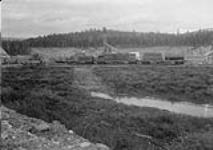 [W.P. & Y.R. at Whitehorse, Y.T. with materials for construction of a dredge.]