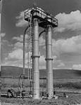 Dehydrating Towers to remove moisture from Natural Gas, Located at the Control Station, Turney Valley Field. The Canadian Western Natural Gas, Light, Heat and Power Co. Ltd., Calgary, Alta 1946