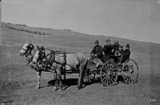 Members of survey party on way to Kamloops, (B.C.), crossing Scheidam Flats - close of season. 1915