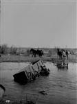 Small creek in flood, Tp. 3--6 at the breakup May 6, 1920