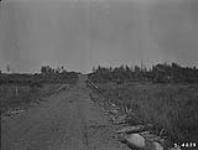 Graded road crossing swampy valley 6 chs. E. of N.E. Sec. 22, Tp. 40-15-2 [near Dahlton, Sask.] 1921