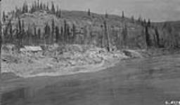 Oil well on banks of Peace River, Alta 1921