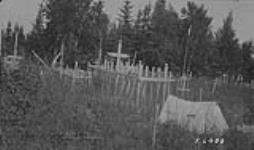Indian graveyard at Pukatawagan, Man 1923