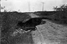 Washout on road, Tp. 19-14-2 [North of Qu'Appelle, Sask.] 1923
