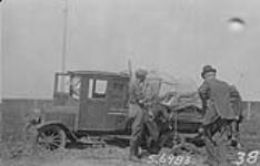 [Truck stuck in mud.] 1923