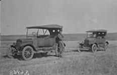 [Ford being towed.] 1923