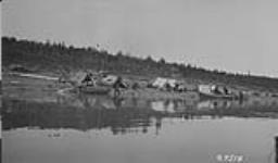 Loucheaux [Loucheux] Indian camp with skin boats. Ft. Norman. [N.W.T.] 1921