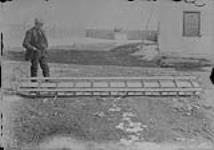 [Exploratory Survey between Great Slave Lake and Hudson Bay, Districts of Mackenzie & Keewatin.] Sleds constructed at Fort Resolution for Expedition