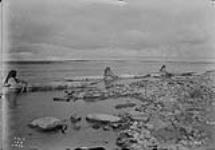 Eskimos in Kyacks on Thelon River, N.W.T 1900