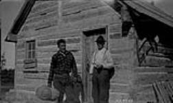 C.S. MacDonald (left) and Adolphe Lapensée (right) at the Sandy Hills trading post, Cochrane River, Manitoba
