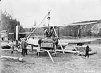 Groundcrew installing Wright J-4 engine in Canadian Vickers 'Vedette' I aircraft G-CYFS of the R.C.A.F., 1926