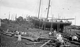 Shelburne, N.S. Caulking up Previous to removing false keel before launching 1927