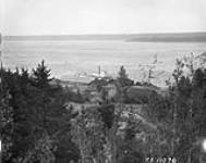 Slave River waterfront at Fort Smith with Steamer "Distributor". [N.W.T.] 1927