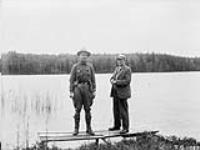 Dr. R.M. Anderson, left and Dr. Halwyn engaged in collecting wood buffalo for Pictorial Museum 1927